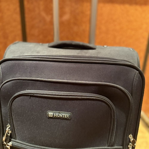 Hunter black trolley suitcase used with telescopic handle