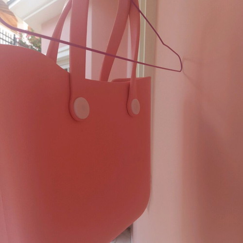 PVC bag pink with white buttons like new, handheld style