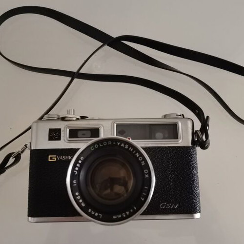 Yashica GSN Electro 35 camera used with Yashinon DX 45mm f/1.7 lens, case, and 2 flashes