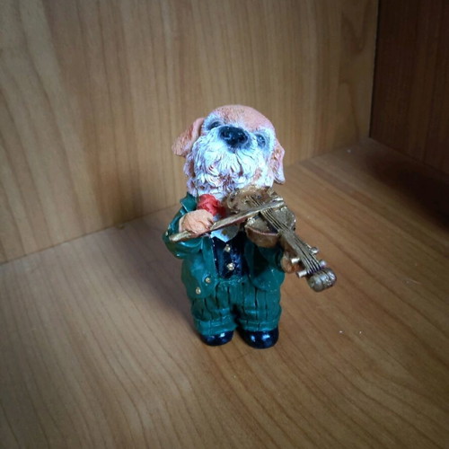 Decorative dog figure with violin like new