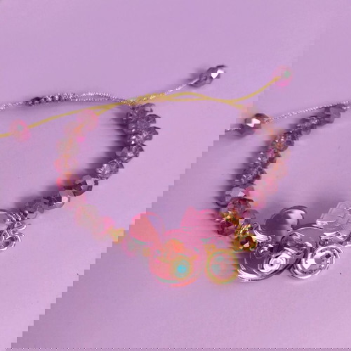 Minnie βραχιόλι λιλά/ροζ/χρυσό like new με ματάκι και ροζ πέτρα