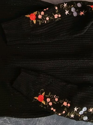 Black sweater used with embroidered flowers