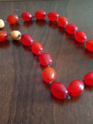 Retro worry beads used, artificial amber coral color with bakelite