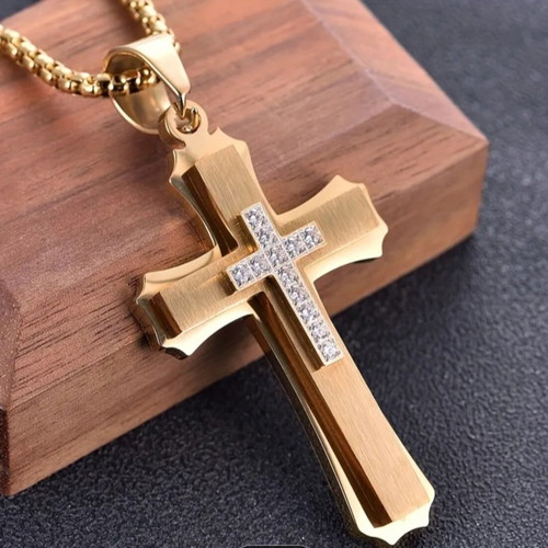 Elegant cross pendant with decorative stones and chain