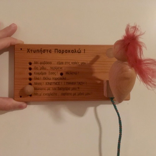Wooden decorative children's door sign used with woodpecker