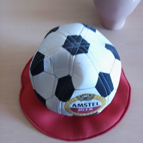 Amstel promotional collectible hat shaped like a football