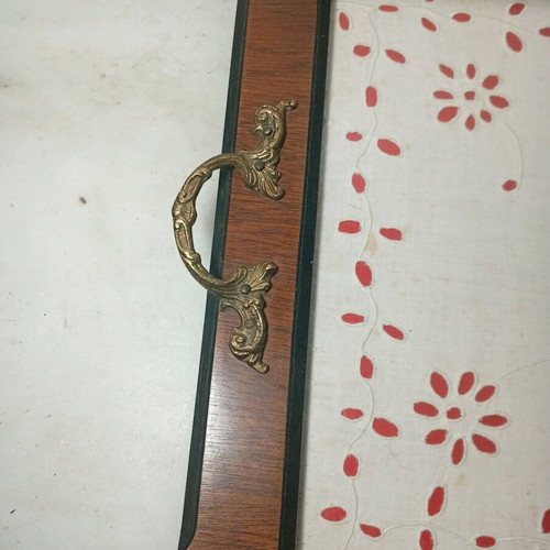 Traditional wooden serving tray used with handmade embroidery