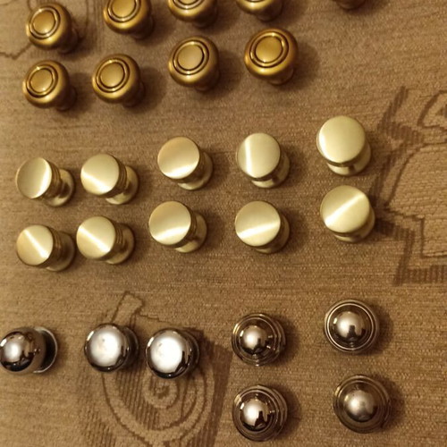 Handles and knobs for cabinets and drawers used, 24 pieces gold and silver