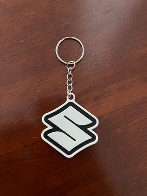 Suzuki keychain like new, black and white