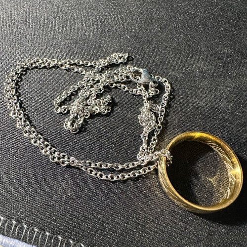 Lord of the Rings ring with chain like new, gold and silver