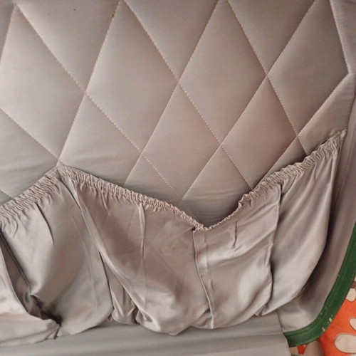 Vintage suitcase used with dark green color and quilted lining