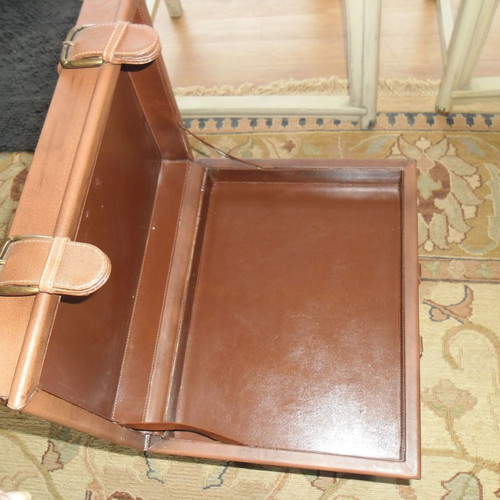 Leather folding table used with suitcase-shaped storage space
