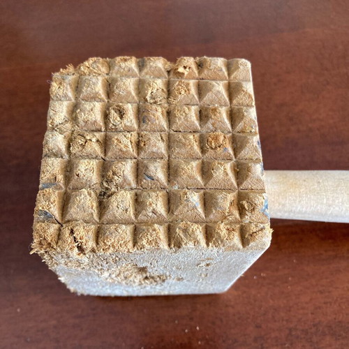Wooden meat tenderizer used