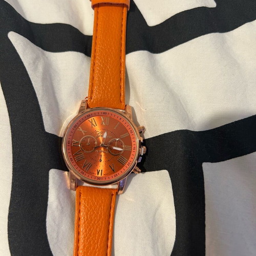 Unisex wristwatch new with orange synthetic leather strap