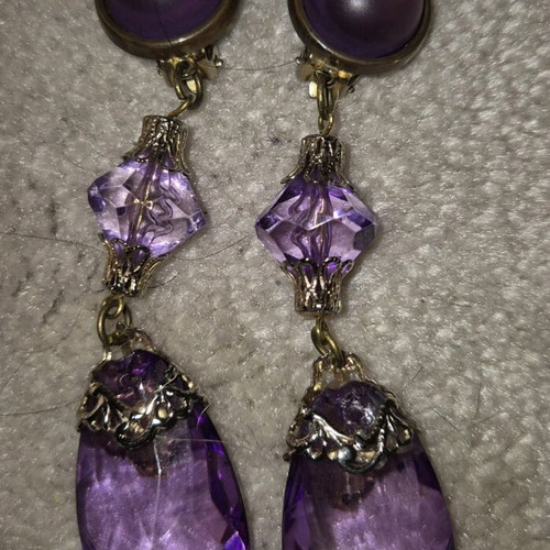 Clip-on earrings used, pack with leather pair