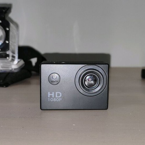 Action camera like new with waterproof case and mounting accessories
