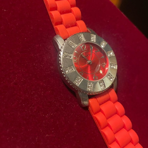 Women's wristwatch like new with red silicone strap and silver case