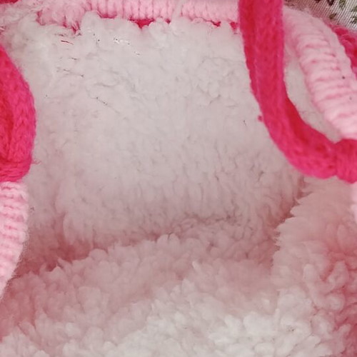 Knitted baby hat with pom pom and cute bunny design, like new