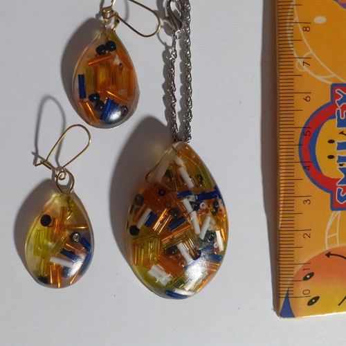 Set of 7 handmade pendant and earring jewelry sets with resin and dried herbs