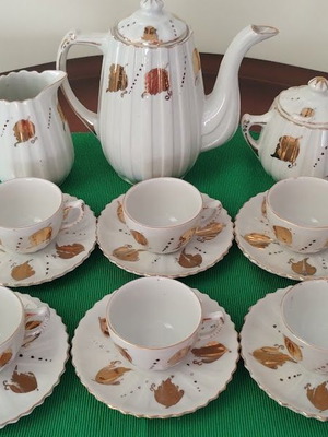 Vintage porcelain tea and coffee set like new with gold leaf decoration