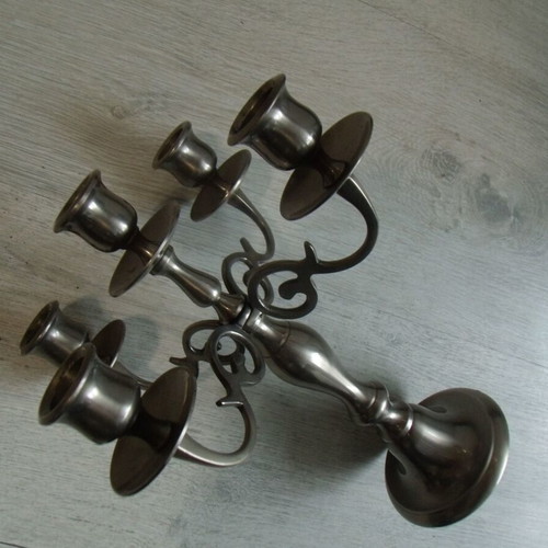 Old metal candlestick with five holders used