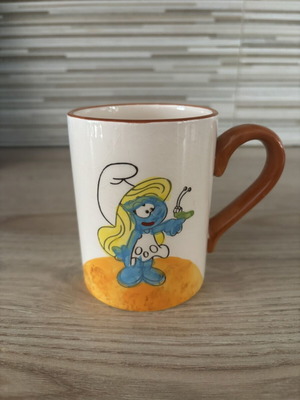 Ceramic mug with Smurfette illustration, used