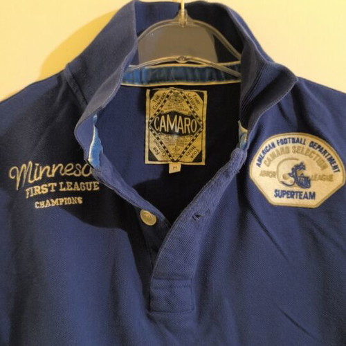 Camaro blue polo shirt with Minnesota First League Champions embroidery