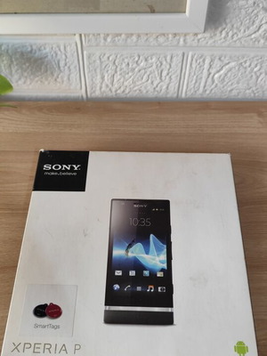 Sony Xperia P smartphone used with original box and accessories