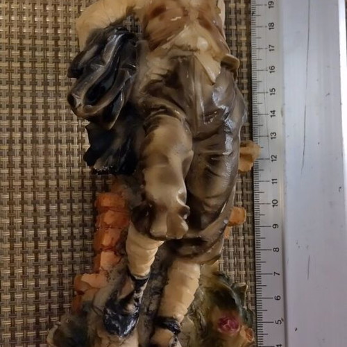 Decorative vintage figurine on wooden base like new