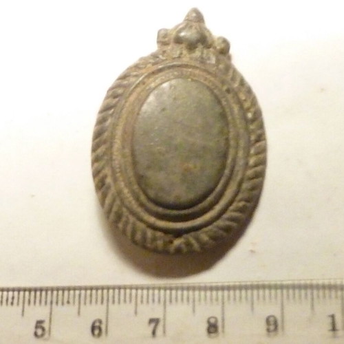 Antique bronze applique from horse harness used