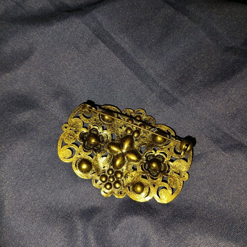 Vintage brooch used with filigree design and gold finish
