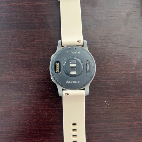 Garmin Vivoactive 4s smartwatch with charger and two straps