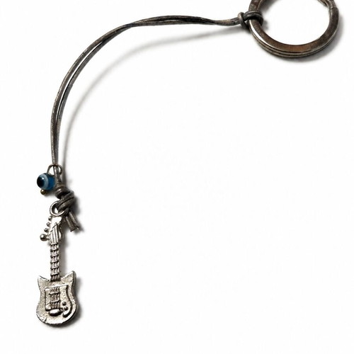 Guitar Keychain like new with metal detail and vintage blue eye