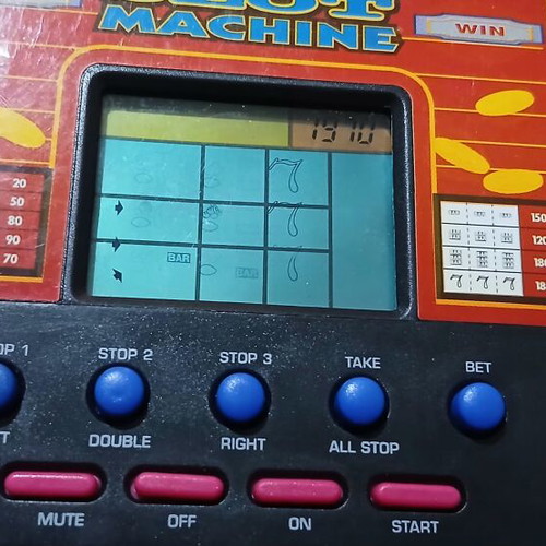 Vintage handheld electronic game slot machine like new