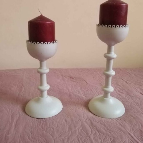 Set of two white metal candlesticks with candle like new