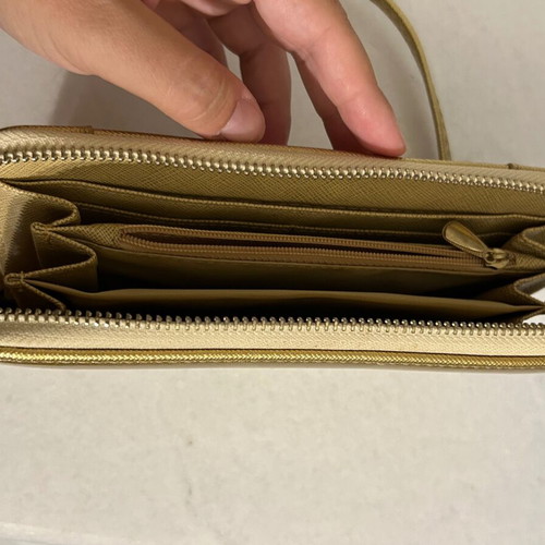 Two gold wallets, one with wrist strap