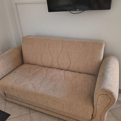 Two-seater sofa bed, beige fabric with storage