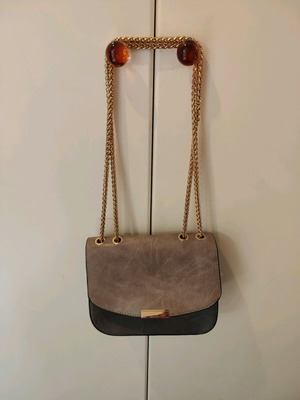 Evening shoulder bag like new with gold chain, two-tone