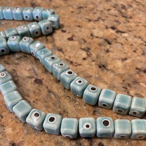 Enamelled ceramic cube-shaped evil eye beads, new, turquoise