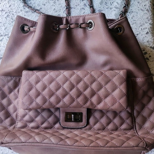 Backpack like new with quilted texture and handles