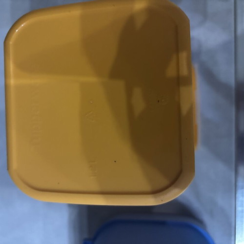 Tupperware canister in two colors