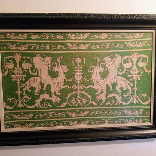 Handmade embroidery in large black Corinthian-style frame, used