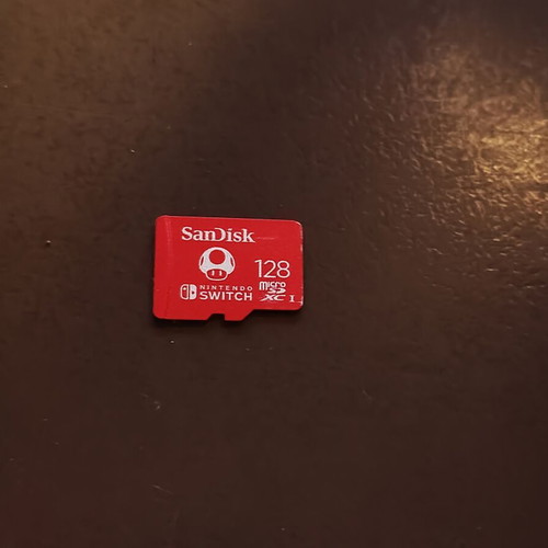 Nintendo Switch V1 patched used with 128GB Mario SD card and case