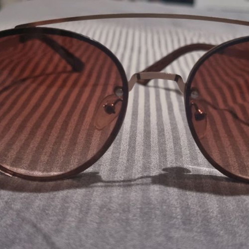 Round glasses used with brown lenses