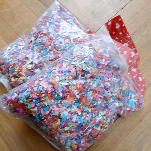Two bags of confetti new, colorful paper pulp