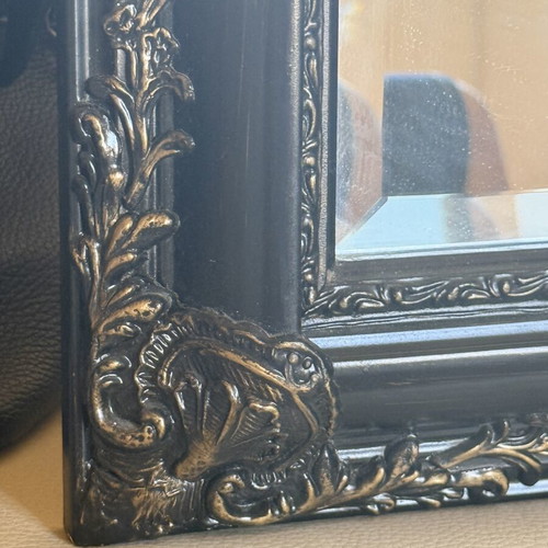 Woodcarved mirror with brass details used