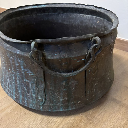 Vintage copper cauldron with hand-forged decoration used