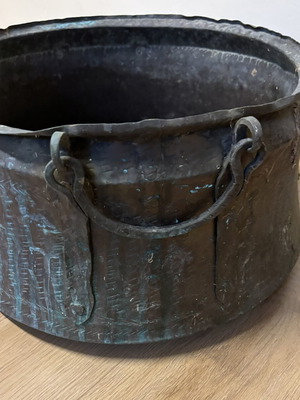Vintage copper cauldron with hand-forged decoration used