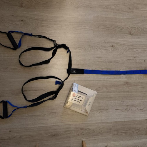 TRX strap used, blue color without ceiling hook
