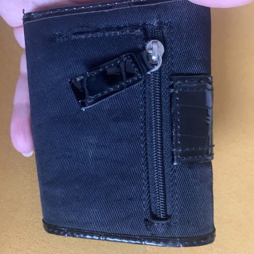 Guess wallet used, black canvas with faux croc details